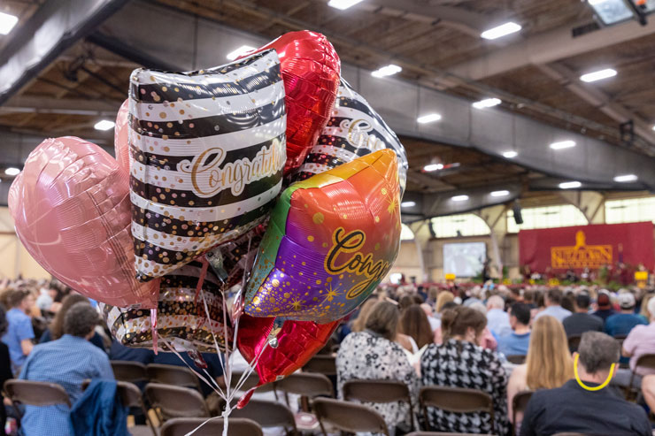 a bunch of balloons in front of the stage at the 2022 Undergraduate commencement