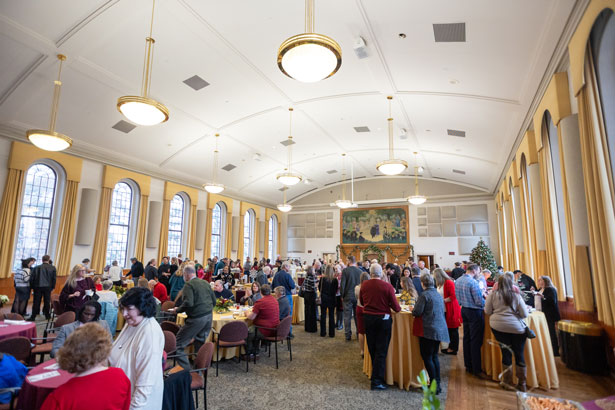 Photo of people at the Holiday Celebration in Old Main Georgian room.