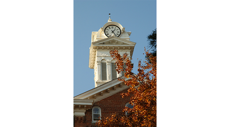 Fall leaves on tree in front of Old Main Clock Tower
