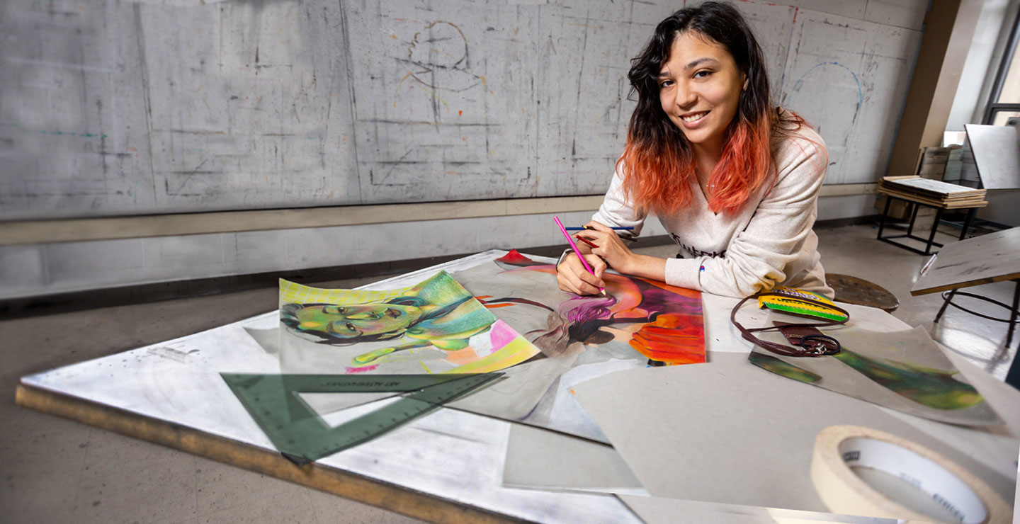 Art Education major Bianca creating in colorful art studio