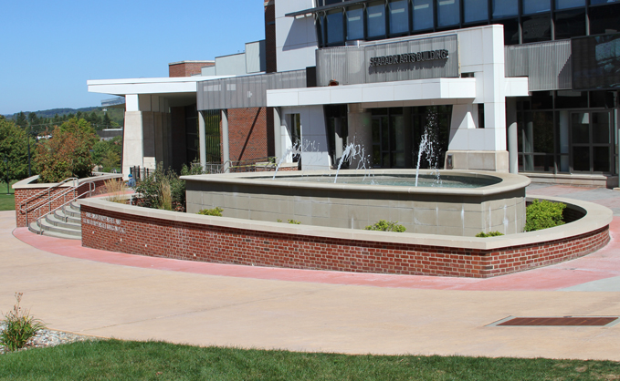 Wideshot image of Marcon Plaza in the springtime, with the fountain on
