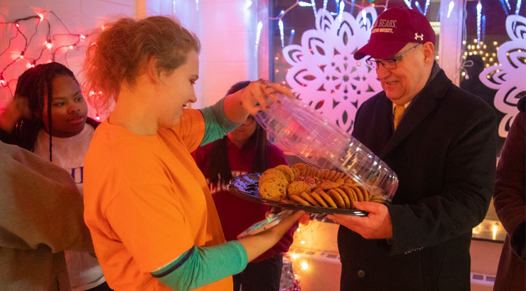 President Hawkinson delivers cookies to residence hall students