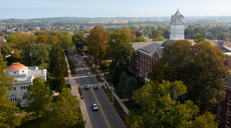 Aerial view of campus with Old Main on the right and Graduate Center on the left with Kutztown Road/Main St. in the middle.