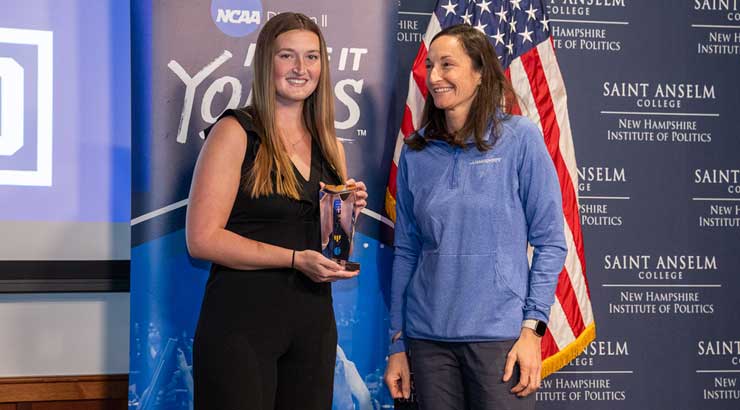 Sarah Gatehouse accepts NCAA Elite 90 Award from NCAA representative.