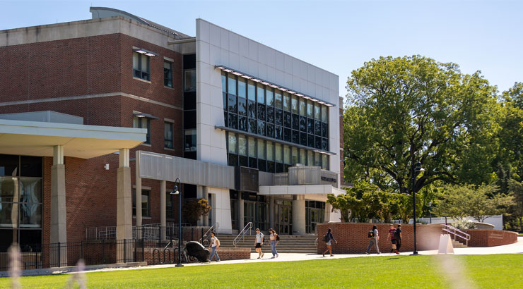 Students walking in front of the Sharadin Arts Building.