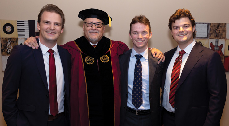 President Cavalier with his three sons.