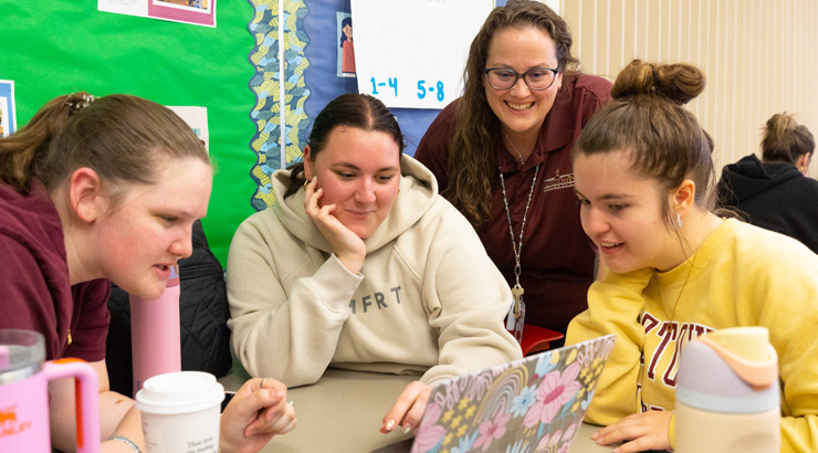 Katie Monahan teaching students in a classroom.