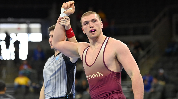 Freddie Retter's hand raised as a wrestling All-American