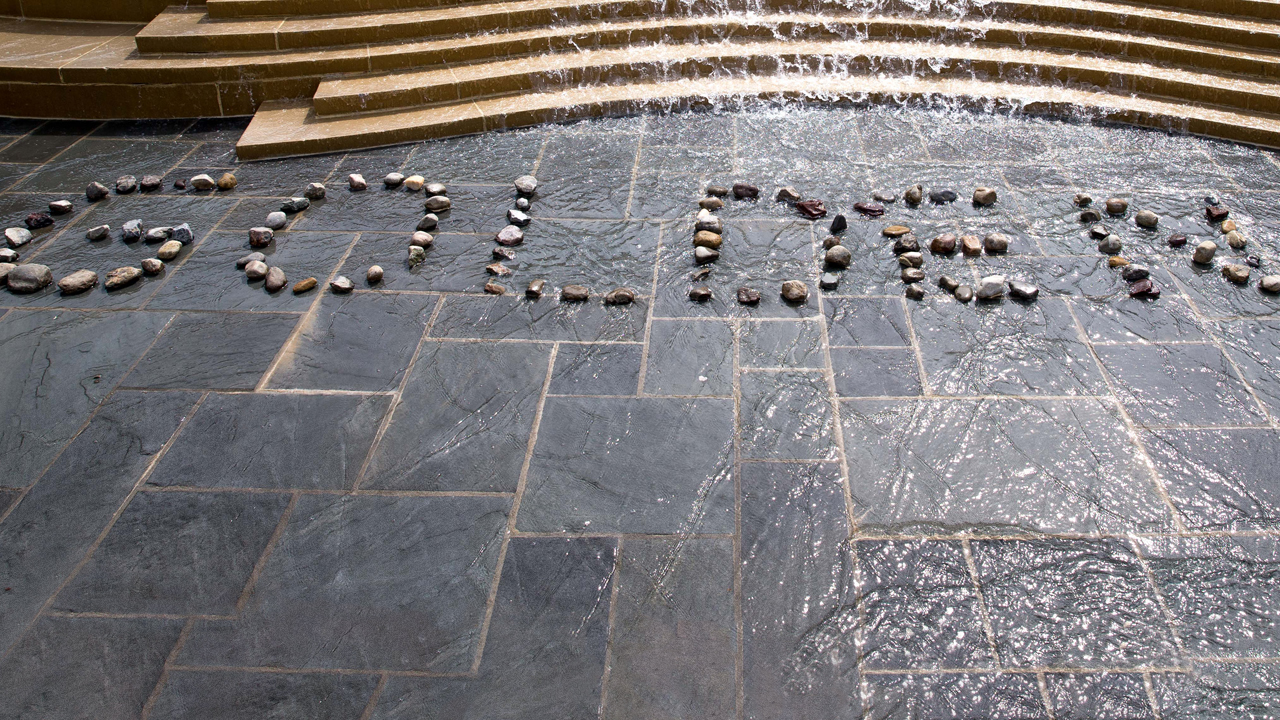 Image of the empty fountain at Kutztown with the word "Golden" written in rocks.